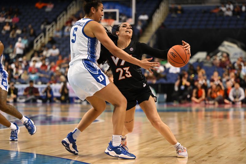 Mar 4, 2023; Greensboro, NC, USA; Virginia Tech Hokies guard Kayana Traylor (23) draws contact from Duke Blue Devils forward Taya Corosdale (5) during the first half at Greensboro Coliseum. Mandatory Credit: William Howard-USA TODAY Sports