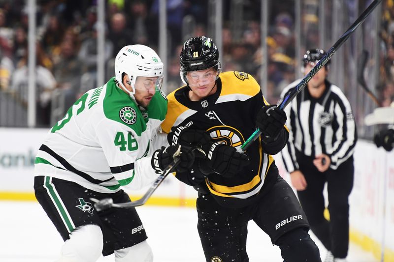 Oct 24, 2024; Boston, Massachusetts, USA;  Dallas Stars defenseman Ilya Lyubushkin (46) and Boston Bruins center Trent Frederic (11) battle during the first period at TD Garden. Mandatory Credit: Bob DeChiara-Imagn Images