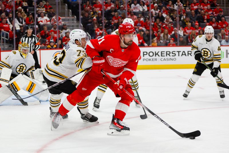 Dec 31, 2023; Detroit, Michigan, USA; Detroit Red Wings center Dylan Larkin (71) handles the puck  during the second period of the game between the Boston Bruins and the Detroit Red Wings at Little Caesars Arena. Mandatory Credit: Brian Bradshaw Sevald-USA TODAY Sports