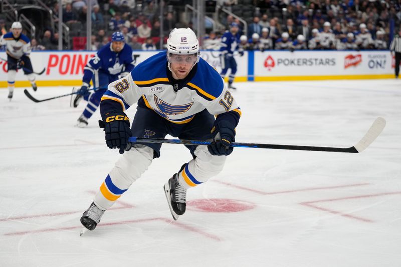 Oct 24, 2024; Toronto, Ontario, CAN; St. Louis Blues forward Radek Faksa (12) skates against the Toronto Maple Leafs during the third period at Scotiabank Arena. Mandatory Credit: John E. Sokolowski-Imagn Images