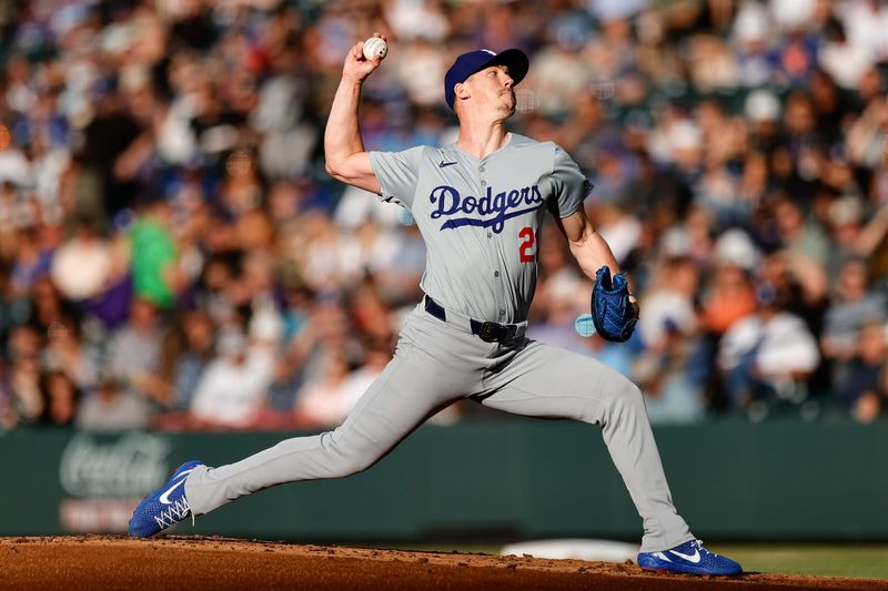 Jun 18, 2024; Denver, Colorado, USA; Los Angeles Dodgers starting pitcher Walker Buehler (21) pitches in the first inning against the Colorado Rockies at Coors Field. Mandatory Credit: Isaiah J. Downing-USA TODAY Sports