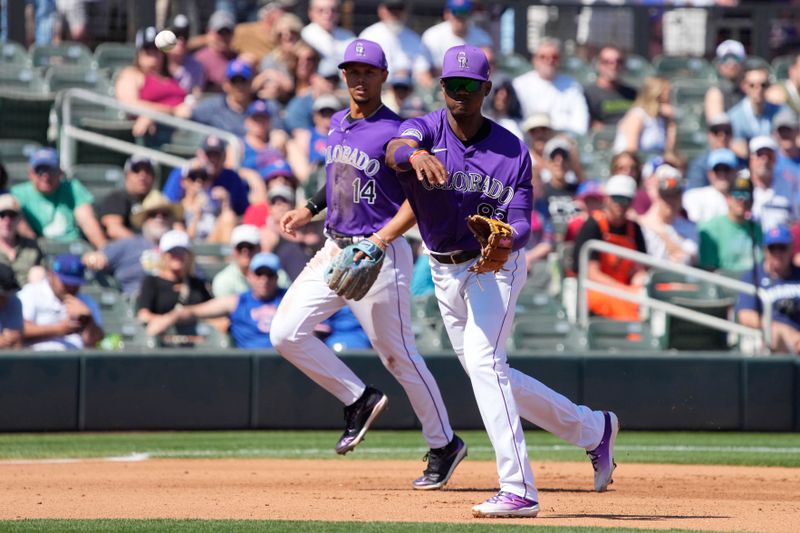 Mar 21, 2024; Salt River Pima-Maricopa, Arizona, USA; Colorado Rockies third baseman Julio Carreras (83) makes the play for an out against the Chicago Cubs in the fourth inning at Salt River Fields at Talking Stick. Mandatory Credit: Rick Scuteri-USA TODAY Sports