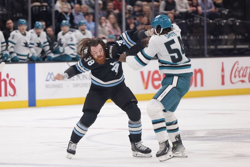 Oct 28, 2024; Salt Lake City, Utah, USA; Utah Hockey Club center Liam O'Brien (38) and San Jose Sharks right wing Givani Smith (54) fight at center ice during the first period at Delta Center. Mandatory Credit: Chris Nicoll-Imagn Images