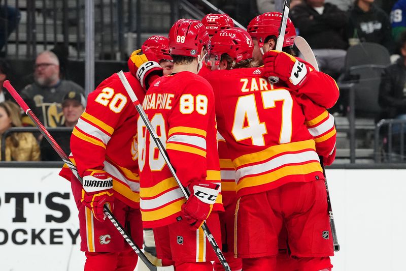 Jan 13, 2024; Las Vegas, Nevada, USA; Calgary Flames center Blake Coleman (20) celebrates with team mates after scoring a goal against the Vegas Golden Knights during the first period at T-Mobile Arena. Mandatory Credit: Stephen R. Sylvanie-USA TODAY Sports