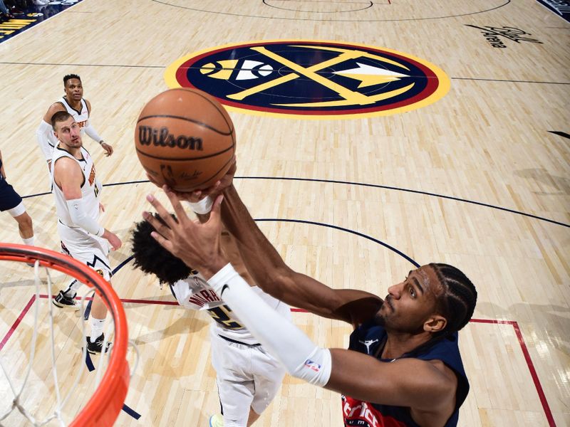 DENVER, CO - MARCH 15: Alexandre Sarr #20 of the Washington Wizards goes up for the rebound during the game against the Denver Nuggets on March 15, 2025 at Ball Arena in Denver, Colorado. NOTE TO USER: User expressly acknowledges and agrees that, by downloading and/or using this Photograph, user is consenting to the terms and conditions of the Getty Images License Agreement. Mandatory Copyright Notice: Copyright 2025 NBAE (Photo by Garrett Ellwood/NBAE via Getty Images)