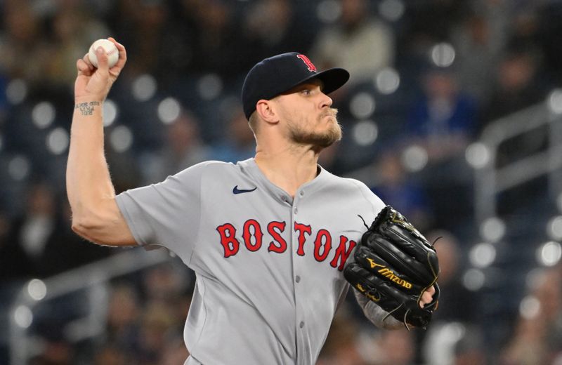 May 1, 2025; Toronto, Ontario, CAN;  Boston Red Sox starting pitcher Lucas Giolito (54) delivers a pitch against the Toronto Blue Jays in the first inning at Rogers Centre. Mandatory Credit: Dan Hamilton-Imagn Images