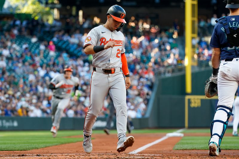Jul 3, 2024; Seattle, Washington, USA; Baltimore Orioles third baseman Ramon Urias (29) scores a run against the Seattle Mariners during the third inning at T-Mobile Park. Mandatory Credit: Joe Nicholson-USA TODAY Sports
