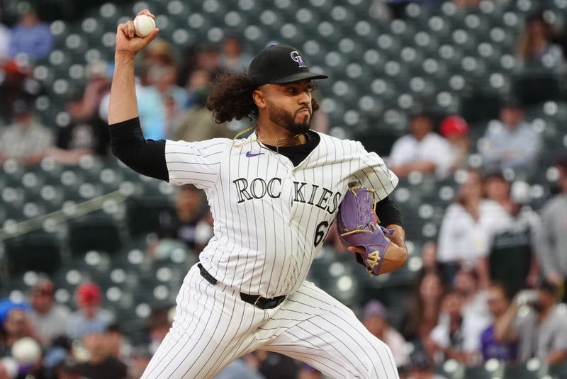 Apr 25, 2024; Denver, Colorado, USA; Colorado Rockies relief pitcher Justin Lawrence (61) delivers a pitch in the ninth inning against the San Diego Padres at Coors Field. Mandatory Credit: Ron Chenoy-USA TODAY Sports