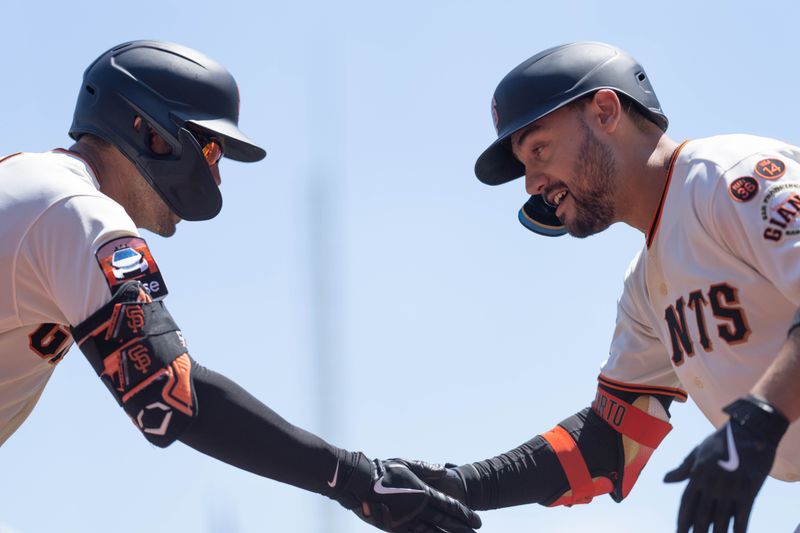 Aug 13, 2023; San Francisco, California, USA; San Francisco Giants catcher Blake Sabol (left) and right fielder Michael Conforto (8) celebrate during the second inning against the Texas Rangers at Oracle Park. Mandatory Credit: Stan Szeto-USA TODAY Sports