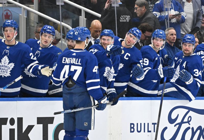 Jan 3, 2023; Toronto, Ontario, CAN;   Toronto Maple Leafs forward Pierre Engvall (47) celebrates with teammates at the bench after scoring against the St. Louis Blues in the first period at Scotiabank Arena. Mandatory Credit: Dan Hamilton-USA TODAY Sports