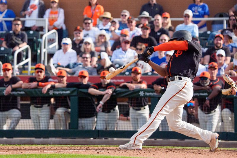 Feb 24, 2024; Scottsdale, Arizona, USA; San Francisco Giants infielder Otto Lopez (54) hits a home run against the Chicago Cubs in the ninth inning during spring training game at Scottsdale Stadium. Mandatory Credit: Allan Henry-USA TODAY Sports