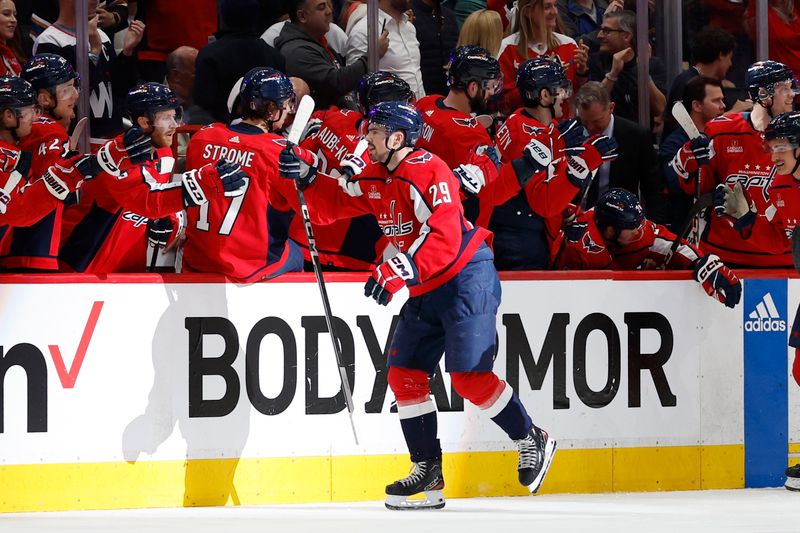 Apr 28, 2024; Washington, District of Columbia, USA; Washington Capitals center Hendrix Lapierre (29) celebrates with teammates after scoring a goal against the New York Rangers in the second period in game four of the first round of the 2024 Stanley Cup Playoffs at Capital One Arena. Mandatory Credit: Geoff Burke-USA TODAY Sports