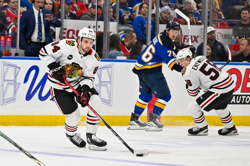 Apr 10, 2024; St. Louis, Missouri, USA;  Chicago Blackhawks left wing Landon Slaggert (84) controls the puck against the St. Louis Blues during the third period at Enterprise Center. Mandatory Credit: Jeff Curry-USA TODAY Sports