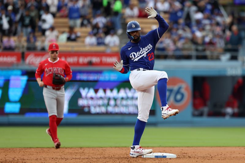 Mar 24, 2024; Los Angeles, California, USA;  Los Angeles Dodgers right fielder Jason Heyward (23) reacts after hitting an RBI double during the second inning against the Los Angeles Angels at Dodger Stadium. Mandatory Credit: Kiyoshi Mio-USA TODAY Sports