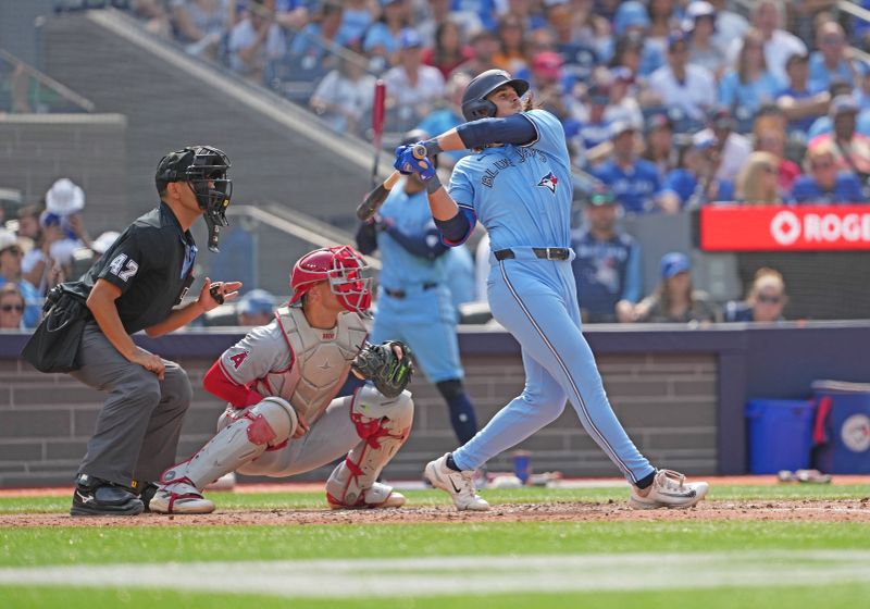 Aug 25, 2024; Toronto, Ontario, CAN; Toronto Blue Jays right fielder Addison Barger (47) hits a two run home run against the Los Angeles Angels during the sixth inning at Rogers Centre. Mandatory Credit: Nick Turchiaro-USA TODAY Sports
