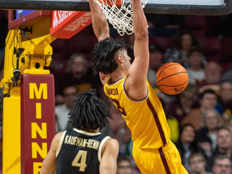 Jan 19, 2023; Minneapolis, Minnesota, USA; Minnesota Golden Gophers forward Dawson Garcia (3) dunks as Purdue Boilermakers forward Trey Kaufman-Renn (4) defends in the second half at Williams Arena. Mandatory Credit: Matt Blewett-USA TODAY Sports