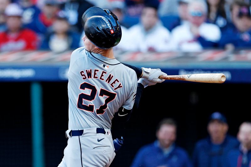 Oct 7, 2024; Cleveland, Ohio, USA; Detroit Tigers shortstop Trey Sweeney (27) swings a pitch during the seventh inning against the Cleveland Guardians during game two of the ALDS for the 2024 MLB Playoffs at Progressive Field. Mandatory Credit: Scott Galvin-Imagn Images