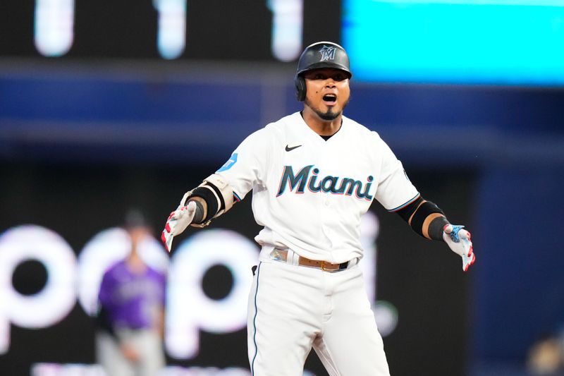 Jul 23, 2023; Miami, Florida, USA; Miami Marlins second baseman Luis Arraez (3) celebrates hitting a double against the Colorado Rockies during the sixth inning at loanDepot Park. Mandatory Credit: Rich Storry-USA TODAY Sports