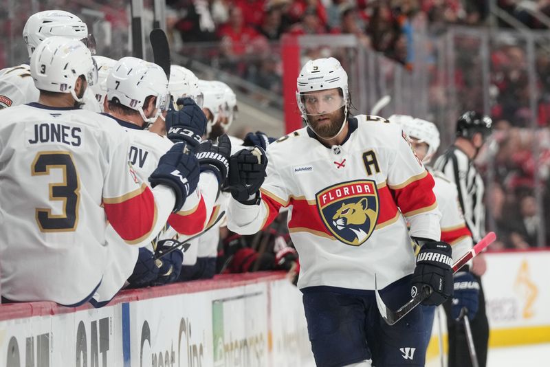 May 20, 2025; Raleigh, North Carolina, USA; Florida Panthers defenseman Aaron Ekblad (5) celebrates scoring against the Carolina Hurricanes during the first period in game one of the Eastern Conference Final of the 2025 Stanley Cup Playoffs at Lenovo Center. Mandatory Credit: James Guillory-Imagn Images