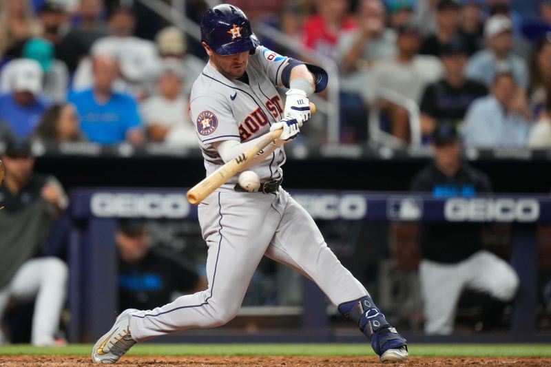 Aug 16, 2023; Miami, Florida, USA; Houston Astros third baseman Alex Bregman (2) hits a double against the Miami Marlins during the seventh inning at loanDepot Park. Mandatory Credit: Rich Storry-USA TODAY Sports
