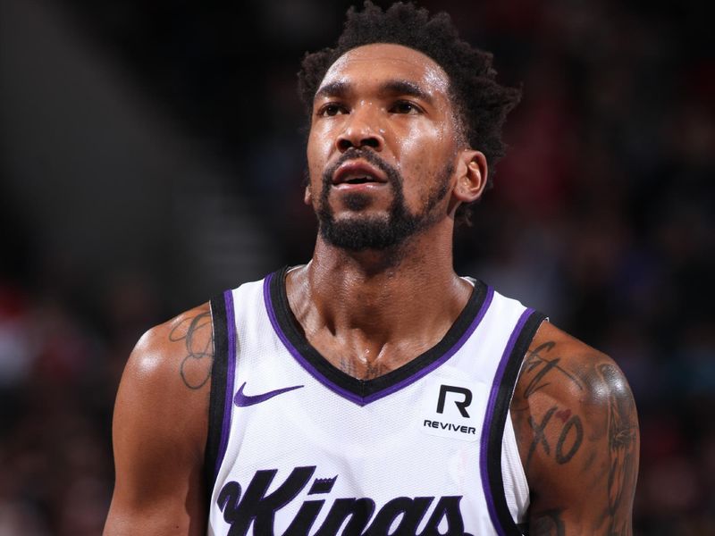 PORTLAND, OR - NOVEMBER 29: Malik Monk #0 of the Sacramento Kings shoots a free throw during the game against the Portland Trail Blazers during the Emirates NBA Cup on November 29, 2024 at the Moda Center Arena in Portland, Oregon. NOTE TO USER: User expressly acknowledges and agrees that, by downloading and or using this photograph, user is consenting to the terms and conditions of the Getty Images License Agreement. Mandatory Copyright Notice: Copyright 2024 NBAE (Photo by Cameron Browne/NBAE via Getty Images)