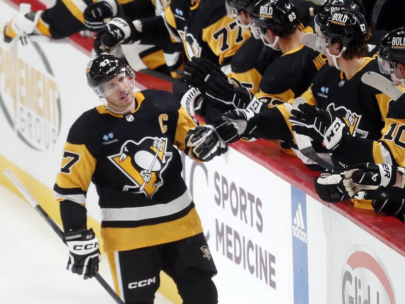 Oct 10, 2023; Pittsburgh, Pennsylvania, USA; Pittsburgh Penguins center Sidney Crosby (87) celebrates with the Pens bench after scoring a goal against the Chicago Blackhawks during the second period at the PPG Paints Arena. Mandatory Credit: Charles LeClaire-USA TODAY Sports