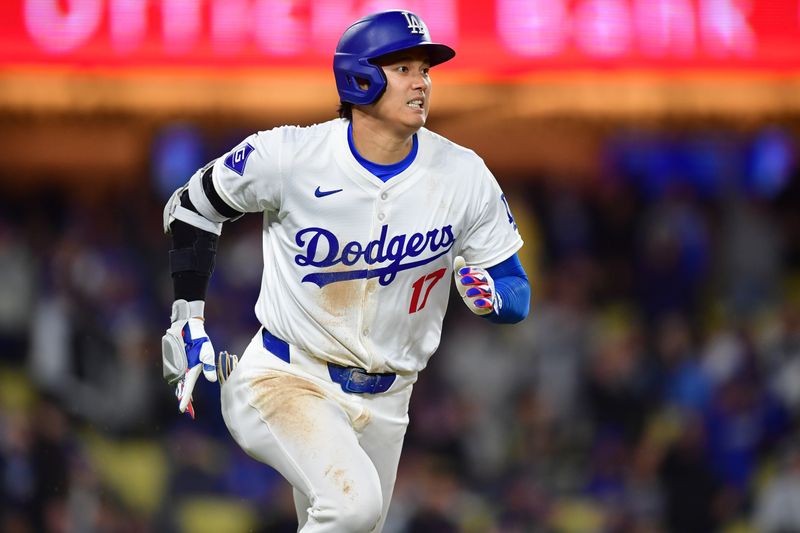 Apr 13, 2024; Los Angeles, California, USA; Los Angeles Dodgers designated hitter Shohei Ohtani (17) runs out a fly ball against the San Diego Padres during the eighth inning at Dodger Stadium. Mandatory Credit: Gary A. Vasquez-USA TODAY Sports