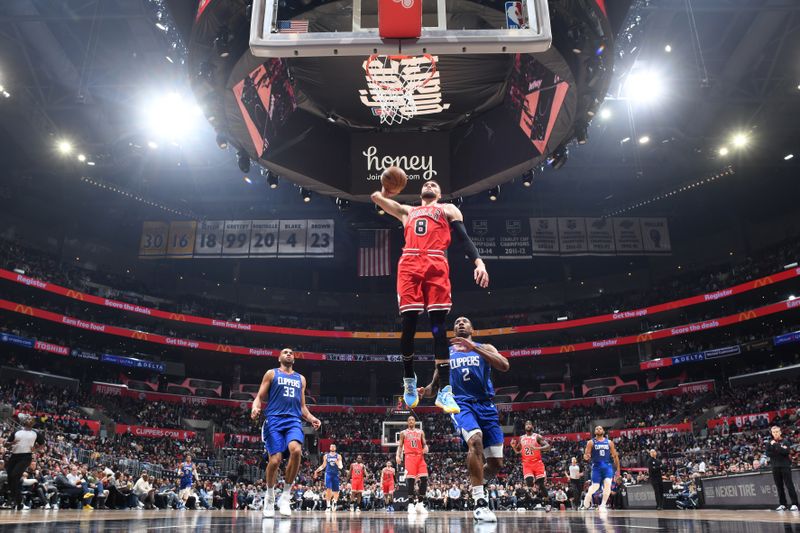 LOS ANGELES, CA - MARCH 27: Zach LaVine #8 of the Chicago Bulls drives to the basket during the game against the LA Clippers on March 27, 2023 at Crypto.Com Arena in Los Angeles, California. NOTE TO USER: User expressly acknowledges and agrees that, by downloading and/or using this Photograph, user is consenting to the terms and conditions of the Getty Images License Agreement. Mandatory Copyright Notice: Copyright 2023 NBAE (Photo by Adam Pantozzi/NBAE via Getty Images)