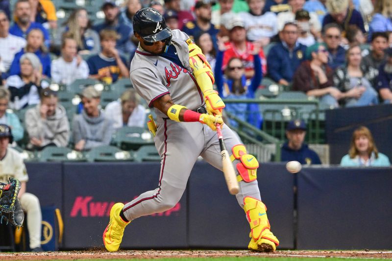 Jun 10, 2025; Milwaukee, Wisconsin, USA;  Atlanta Braves right fielder Ronald Acuna (13) hits a single in the third inning against the Milwaukee Brewers at American Family Field. Mandatory Credit: Benny Sieu-Imagn Images