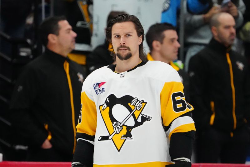 Mar 24, 2024; Denver, Colorado, USA;  Pittsburgh Penguins defenseman Erik Karlsson (65) before the game against the Colorado Avalanche at Ball Arena. Mandatory Credit: Ron Chenoy-USA TODAY Sports