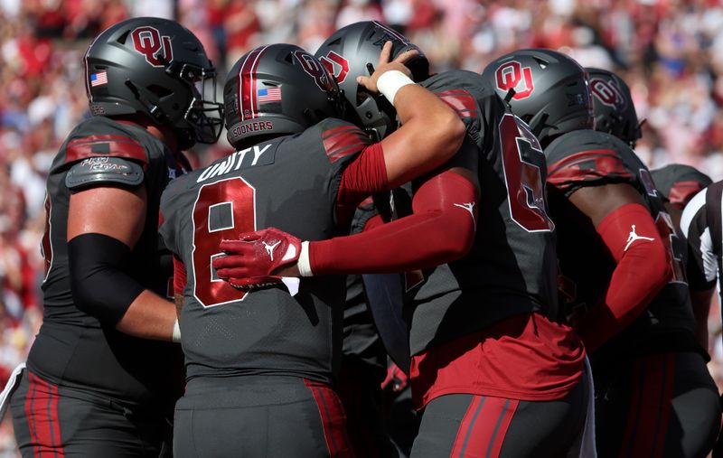 Oct 15, 2022; Norman, Oklahoma, USA;  Oklahoma Sooners running back Jovantae Barnes (2) celebrates with Oklahoma Sooners quarterback Dillon Gabriel (8) and teammates after scoring a touchdown during the first half against the Kansas Jayhawks at Gaylord Family-Oklahoma Memorial Stadium. Mandatory Credit: Kevin Jairaj-USA TODAY Sports