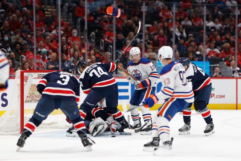 Nov 24, 2023; Washington, District of Columbia, USA; Washington Capitals goaltender Charlie Lindgren (79) makes a save on Edmonton Oilers left wing Zach Hyman (18) in the second period at Capital One Arena. Mandatory Credit: Geoff Burke-USA TODAY Sports