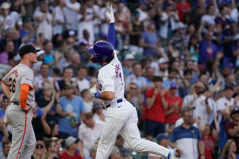 Jun 18, 2024; Chicago, Illinois, USA; Chicago Cubs shortstop Dansby Swanson (7) gestures after hitting a two-run home run against the San Francisco Giants during the second inning at Wrigley Field. Mandatory Credit: David Banks-USA TODAY Sports