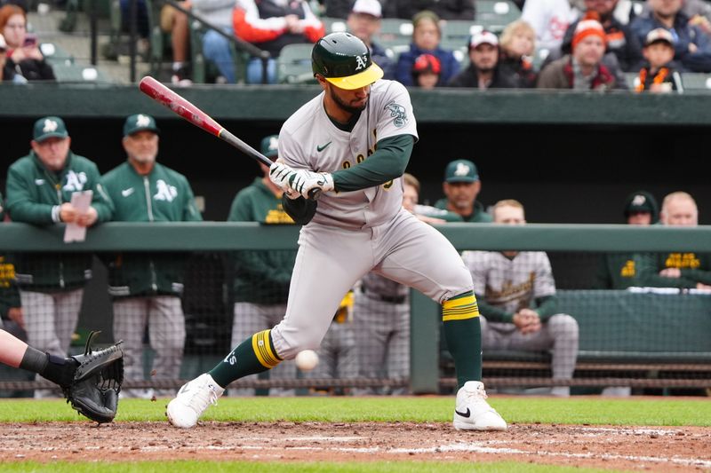 Apr 27, 2024; Baltimore, Maryland, USA; Oakland Athletics first baseman Abraham Toro (31) gets hit in the knee by a pitch during the seventh inning against the Baltimore Orioles at Oriole Park at Camden Yards. Mandatory Credit: Gregory Fisher-USA TODAY Sports