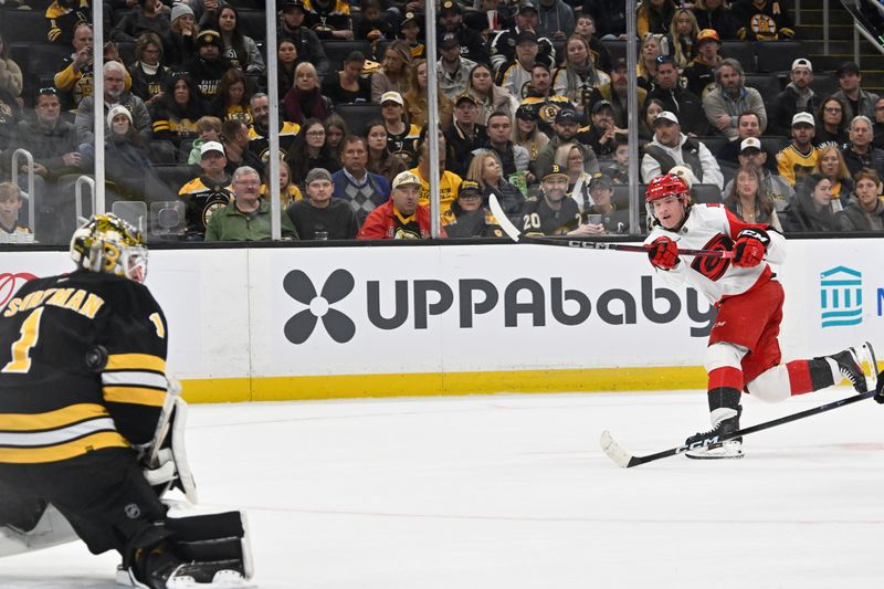 Nov 1, 2025; Boston, Massachusetts, USA; Carolina Hurricanes right wing Jackson Blake (53) shoots past Boston Bruins goaltender Jeremy Swayman (1) during the second period at TD Garden. Mandatory Credit: Eric Canha-Imagn Images