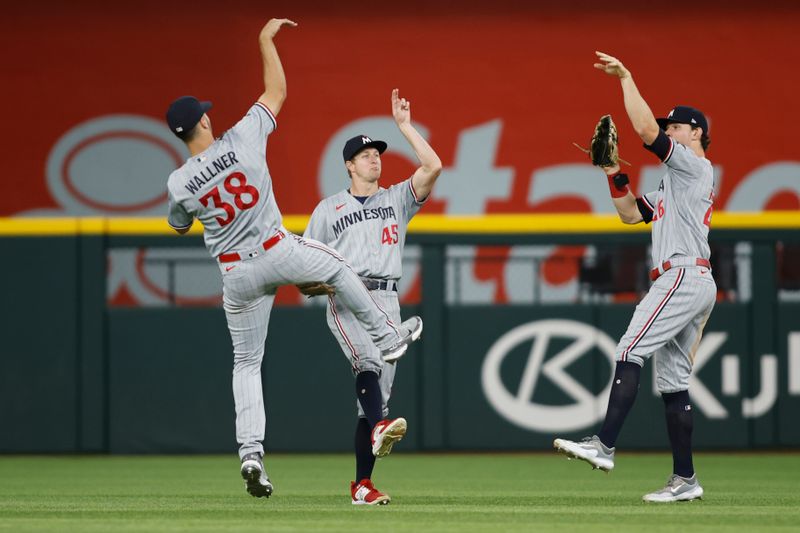 Sep 2, 2023; Arlington, Texas, USA; Minnesota Twins right fielder Matt Wallner (38) and center fielder Andrew Stevenson (45) and right fielder Max Kepler (26) celebrate after the game against the Texas Rangers at Globe Life Field. Mandatory Credit: Tim Heitman-USA TODAY Sports