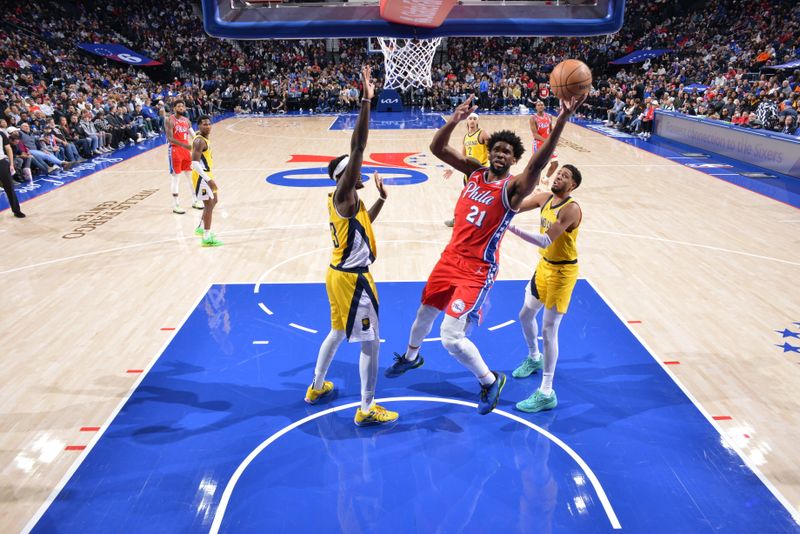 PHILADELPHIA, PA - DECEMBER 13: Joel Embiid #21 of the Philadelphia 76ers drives to the basket during the game against the Indiana Pacers on December 13, 2024 at the Wells Fargo Center in Philadelphia, Pennsylvania NOTE TO USER: User expressly acknowledges and agrees that, by downloading and/or using this Photograph, user is consenting to the terms and conditions of the Getty Images License Agreement. Mandatory Copyright Notice: Copyright 2024 NBAE (Photo by Jesse D. Garrabrant/NBAE via Getty Images)