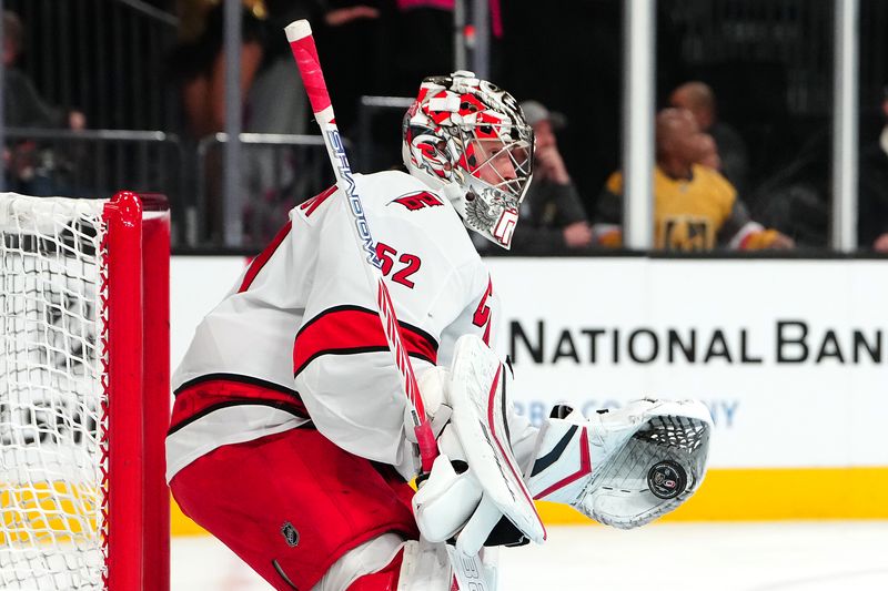 Nov 11, 2024; Las Vegas, Nevada, USA; Carolina Hurricanes goaltender Pyotr Kochetkov (52) warms up before a game against the Vegas Golden Knights at T-Mobile Arena. Mandatory Credit: Stephen R. Sylvanie-Imagn Images