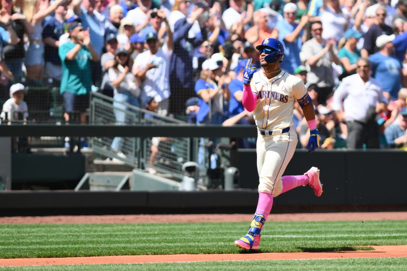 May 12, 2024; Seattle, Washington, USA; Seattle Mariners center fielder Julio Rodriguez (44) runs towards home plate after hitting a 2-run home run against the Oakland Athletics during the second inning at T-Mobile Park. Mandatory Credit: Steven Bisig-USA TODAY Sports