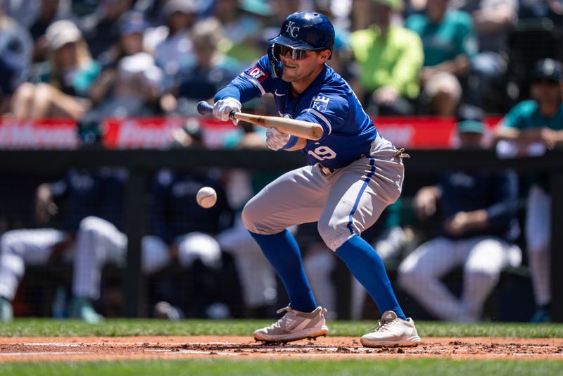 May 15, 2024; Seattle, Washington, USA; Kansas City Royals second baseman Michael Massey (19) bunts the ball for a base hit during the second inning against the Seattle Mariners at T-Mobile Park. Mandatory Credit: Stephen Brashear-USA TODAY Sports