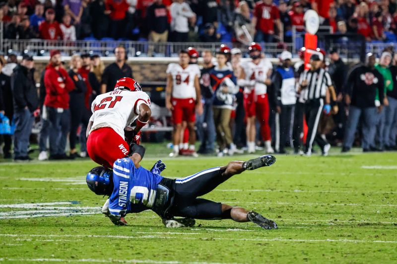 Oct 14, 2023; Durham, North Carolina, USA; Duke Blue Devils safety Jaylen Stinson (2) tackles North Carolina State Wolfpack wide receiver Jalen Coit (21) during the second half of the game against at Wallace Wade Stadium. Mandatory Credit: Jaylynn Nash-USA TODAY Sports