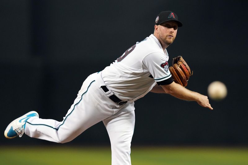 Sep 30, 2023; Phoenix, Arizona, USA; Arizona Diamondbacks starting pitcher Merrill Kelly (29) pitches against the Houston Astros during the third inning at Chase Field. Mandatory Credit: Joe Camporeale-USA TODAY Sports