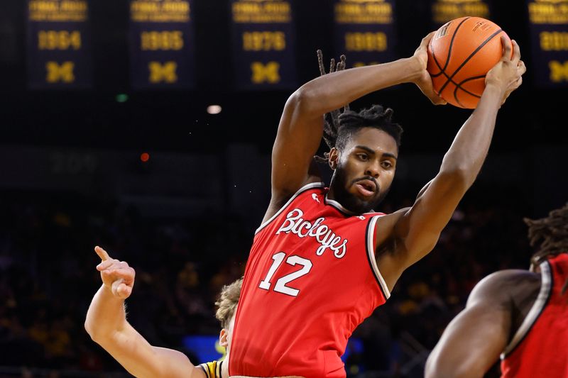 Jan 15, 2024; Ann Arbor, Michigan, USA; Ohio State Buckeyes guard Evan Mahaffey (12) rebounds in the first half against the Michigan Wolverines at Crisler Center. Mandatory Credit: Rick Osentoski-USA TODAY Sports