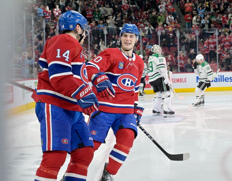 Feb 10, 2024; Montreal, Quebec, CAN; Montreal Canadiens forward Nick Suzuki (14) celebrates with forward Juraj Slafkovsky (20) after scoring a goal against Dallas Stars goalie Jake Oettinger (29) during the second period at the Bell Centre. Mandatory Credit: Eric Bolte-USA TODAY Sports