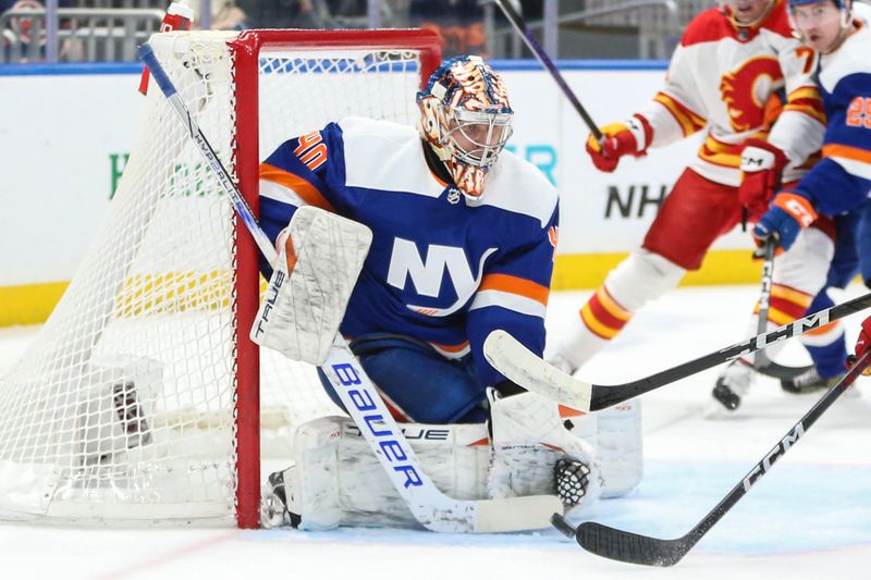 Feb 10, 2024; Elmont, New York, USA;  New York Islanders goaltender Semyon Varlamov (40) defends the net in the first period against the Calgary Flames at UBS Arena. Mandatory Credit: Wendell Cruz-USA TODAY Sports