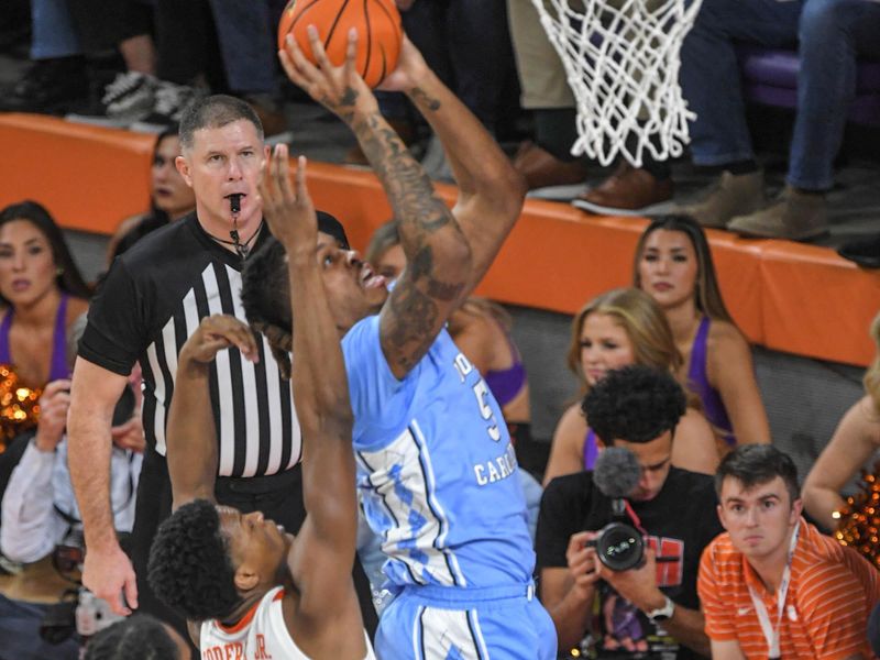 Jan 6, 2024; Clemson, South Carolina, USA; University of North Carolina center Armando Bacot (5) scores near Clemson sophomore RJ Godfrey (10)  during the first half  at Littlejohn Coliseum. Mandatory Credit: Ken Ruinard-USA TODAY Sports