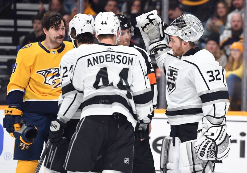 Jan 21, 2023; Nashville, Tennessee, USA; Nashville Predators left wing Filip Forsberg (9) and Los Angeles Kings goaltender Jonathan Quick (32) exchange words after a scrum during the first period at Bridgestone Arena. Mandatory Credit: Christopher Hanewinckel-USA TODAY Sports