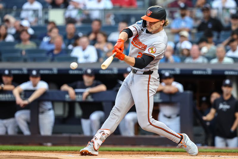 Jun 19, 2024; Bronx, New York, USA;  Baltimore Orioles shortstop Gunnar Henderson (2) hits a double in the first inning against the New York Yankees at Yankee Stadium. Mandatory Credit: Wendell Cruz-USA TODAY Sports