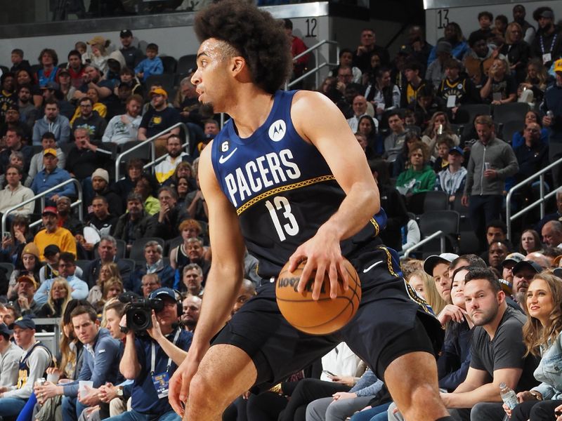 INDIANAPOLIS, IN - MARCH 27: Jordan Nwora #13 of the Indiana Pacers dribbles the ball during the game against the Dallas Mavericks on March 27, 2023 at Gainbridge Fieldhouse in Indianapolis, Indiana. NOTE TO USER: User expressly acknowledges and agrees that, by downloading and or using this Photograph, user is consenting to the terms and conditions of the Getty Images License Agreement. Mandatory Copyright Notice: Copyright 2023 NBAE (Photo by Ron Hoskins/NBAE via Getty Images)