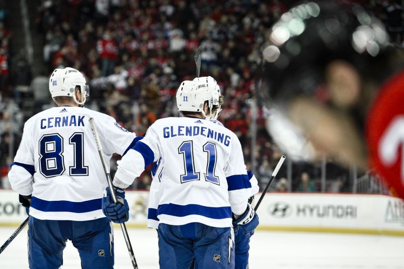 Feb 25, 2024; Newark, New Jersey, USA; Tampa Bay Lightning right wing Nikita Kucherov (86) celebrates with teammates after scoring a goal against the New Jersey Devils during the third period at Prudential Center. Mandatory Credit: John Jones-USA TODAY Sports